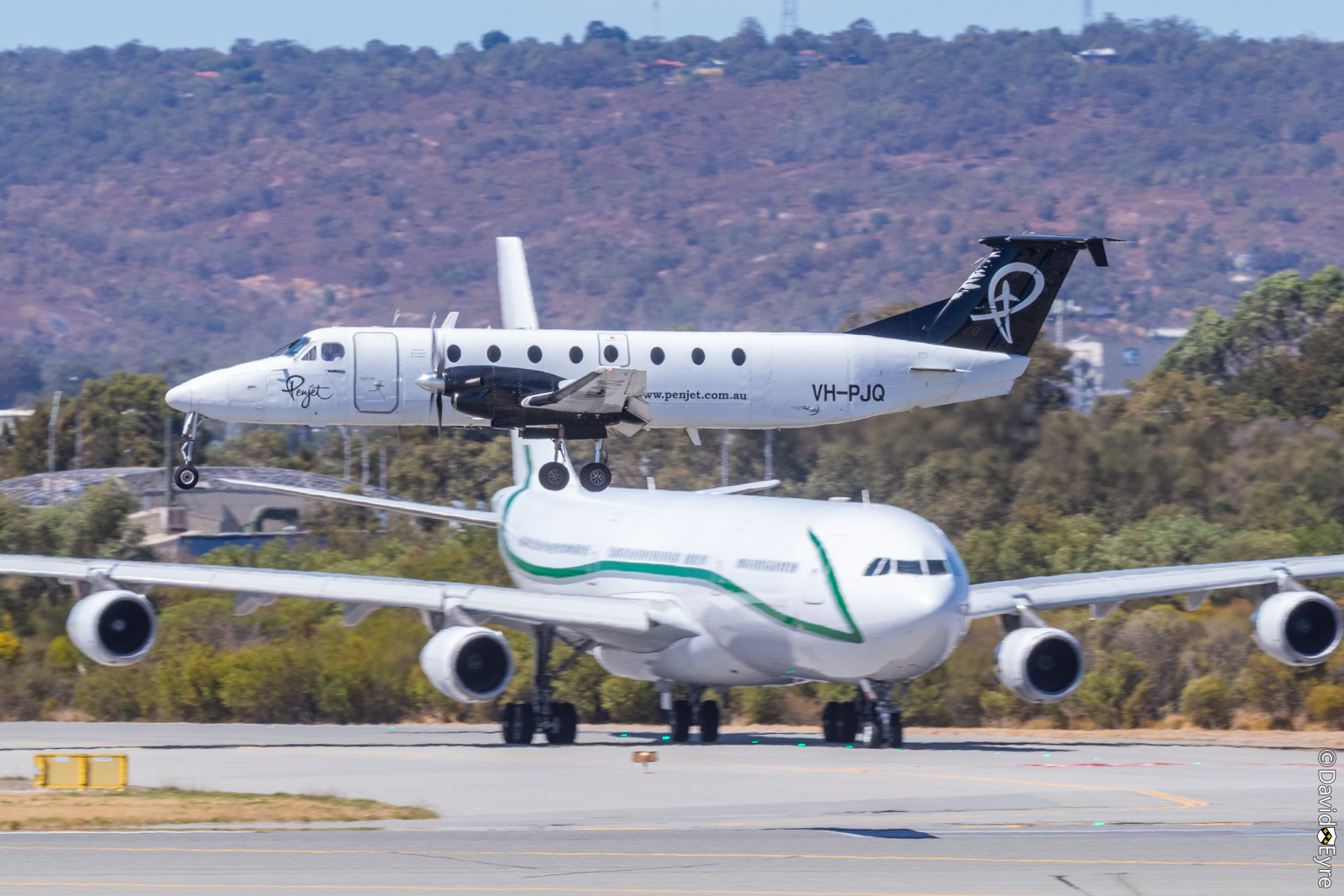 VH-PJQ Beech 1900C-1 of Penjet Pty Ltd, and 9H-BIG A340-312CJ of AirX ...